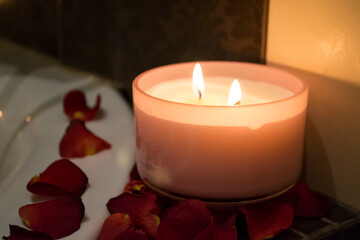Candles and rose petals close up.