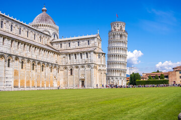 Pisa, Italy - August 14, 2019: View of the Pisa Cathedral with the Leaning Tower of Pisa in Piazza dei Miracoli of Pisa, region of Tuscany, Italy