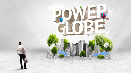 Rear view of a businessman standing in front of POWER GLOBE inscription, Environmental protection concept