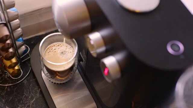 Espresso being made with a coffee pods machine