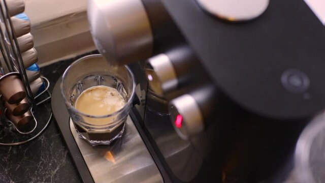 Espresso being made with a coffee pods machine