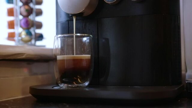 Espresso being made with a coffee pods machine