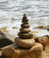 a tower of stones on the beach