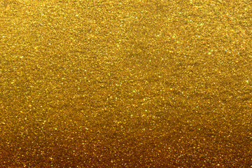 Luxury gold glitter texture with bright sparkles and flickers on the white isolated background. Shiny glamour background