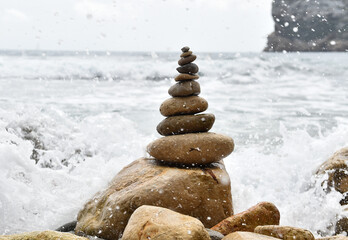 a tower of stones on the beach