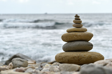a tower of stones on the beach