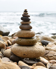 a tower of stones on the beach