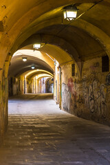 Pisa, Italy - August 14, 2019: Passages under the houses to get to other houses in the old town of Pisa, Tuscany, Italy