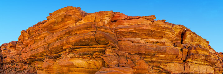 Colourful rock strata form the walls of the Coloured Canyon near Nuweiba, Egypt in summer