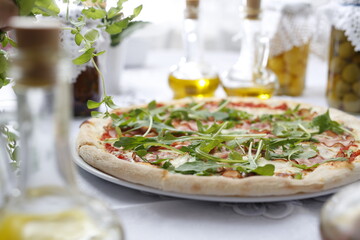 Pizza with ripening ham and arugula.
Traditional Italian pizza. Suggestion to serve a dish. Food background.