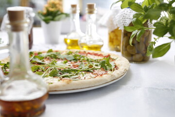 Pizza with ripening ham and arugula.
Traditional Italian pizza. Suggestion to serve a dish. Food background.