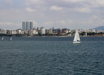 Istanbul Anatolian side view. White sailboats. Istanbul Moda shore.