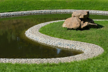 a beautiful pond in a summer park