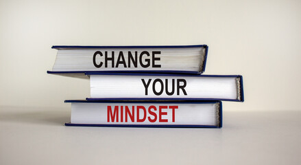 Books with text 'change your mindset' on beautiful white background. Business concept. Copy space.