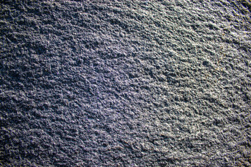 Unpolished granite surface. Warm sunlight. Beautiful background. Concept image.