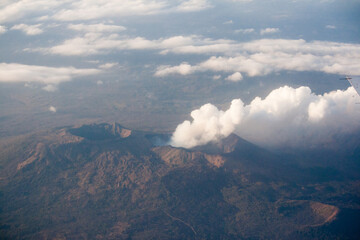 Aerial view of active volcano releasing smoke 

