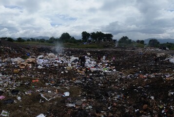 A homeless man at a landfill