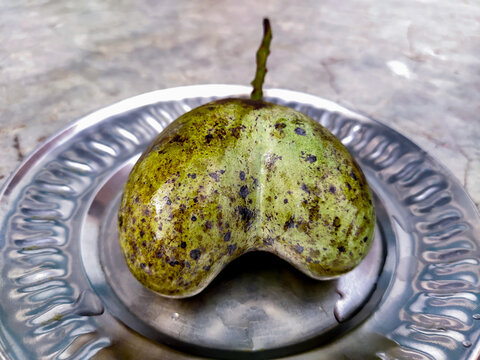 Ripe Heart (LOVE) shape mango isolated on Steel Pot