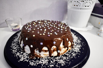 Homemade cake. Strawberry and banana cake poured with chocolate.