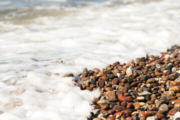 Pebbles on a sandy beach
