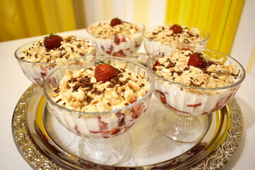 Strawberry dessert with cream sprinkled on top of cookies