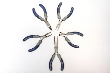 Set of pliers commonly used in jewelry making, isolated on a white background