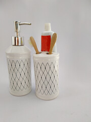 
our toothbrush holder with toothpaste and hand soap