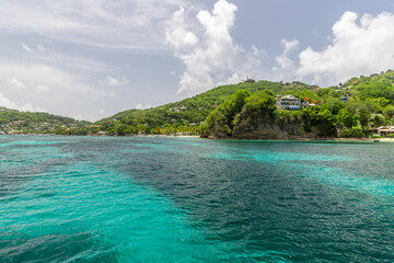 Turquoise water in Admiralty Bay with sailboats and hills in the background, Bequia, Saint Vincent and the Grenadines