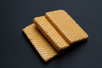 Three wafer cookies filled with strawberry cream.