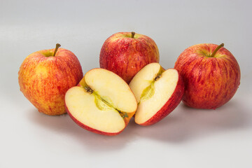 Fototapeta na wymiar Selected apples and apple slices over white background