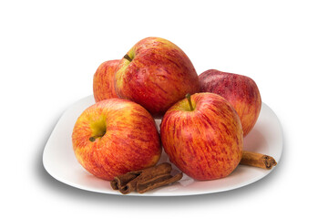 Apple. Slices of apple on the plate with cinnamon in pieces.