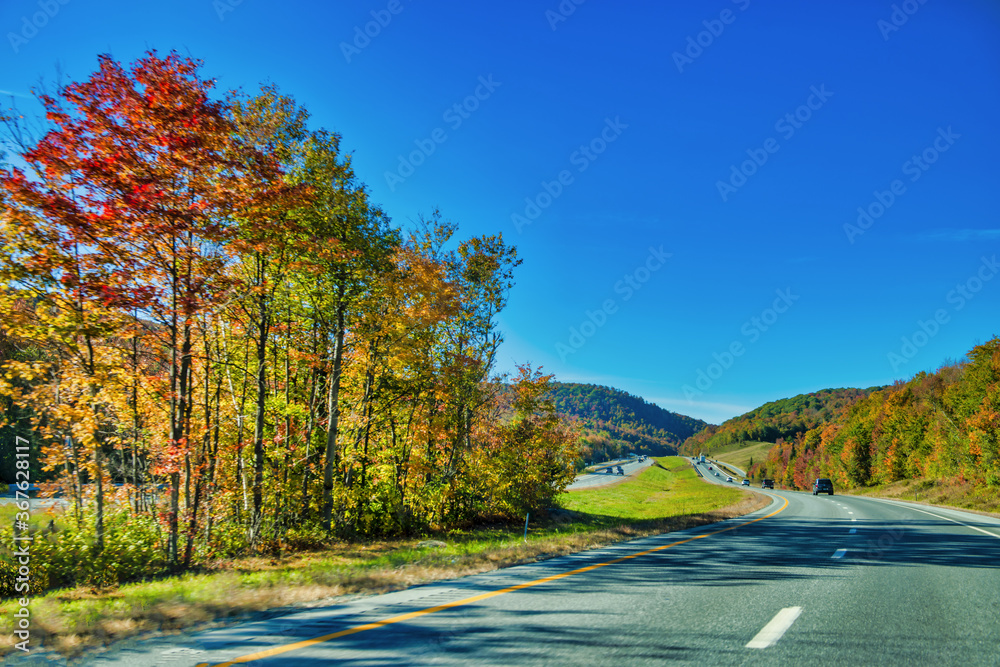 Sticker Beautiful road of New England in foliage season, USA