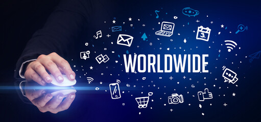 hand holding wireless peripheral with WORLDWIDE inscription, social media concept