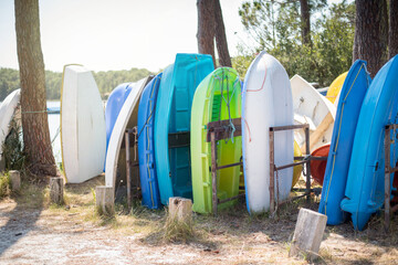 Fishing boats. Multi-colored boats on the shore. Small boats for a lake or pond.