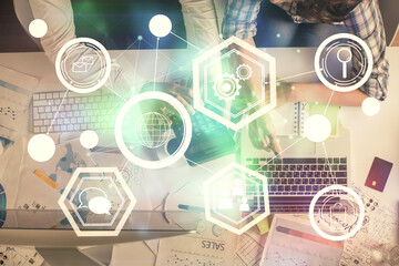 Double exposure of man and woman working together and social network theme hologram drawing. Computer background. connecting concept. Top View.