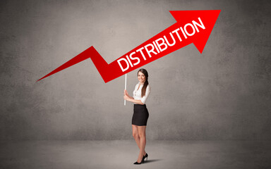 Fototapeta premium Young business person in casual holding road sign with DISTRIBUTION inscription, business direction concept