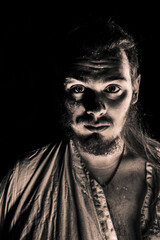 A portrait of a man with beard black and white