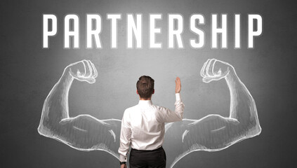 Rear view of a businessman with PARTNERSHIP inscription, powerfull business concept