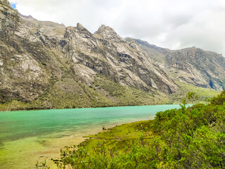 Turquoise lagoon in the mountains of peru near huaraz