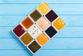 Set of different sauces in ceramic bowl