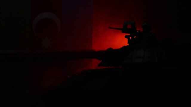 Azeri army concept. Silhouette of armored vehicle against Azerbaijani flag. Creative artwork decoration. Military silhouettes fighting scene dark toned foggy background. Selective focus