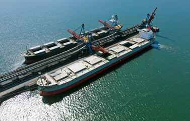 cargo ship loading in coal cargo terminal