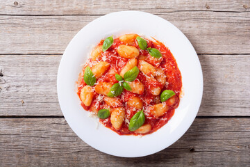 Italian homemade potatoes gnocchi with tomatoes sauce