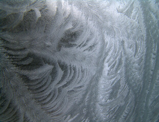 Frosty winter background photo of ice buildup on a window