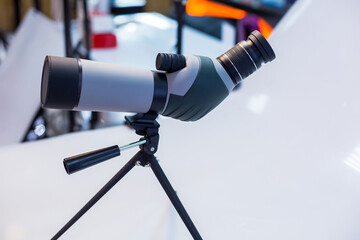 Monocular telescope in store shop. Telescope mounted on a tripod. 