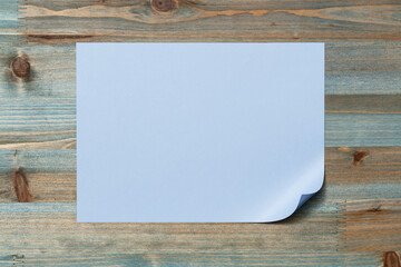 Blank sheet of paper on wooden table
