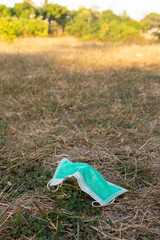 Improperly discarding used surgical face mask