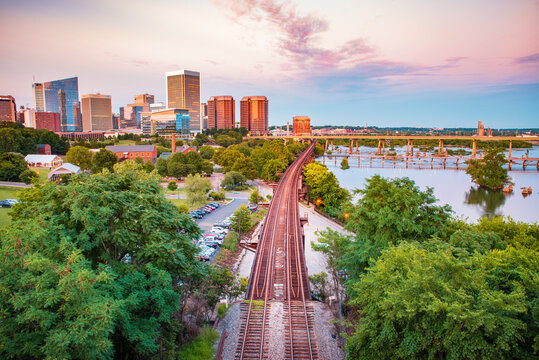 Railway track crossing by the City of Richmond as the golden hour light reflects off the Downtown buildings