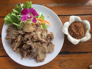 Steamed beef with galangal chili paste.