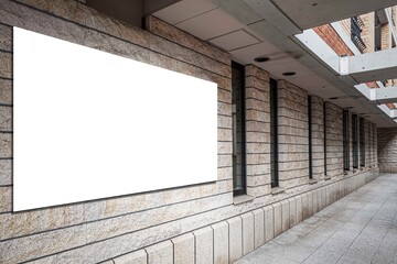 A large blank advertising sign is attached to the mall entrance area